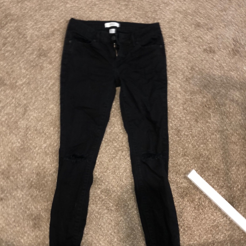 Black knee ripped jeans